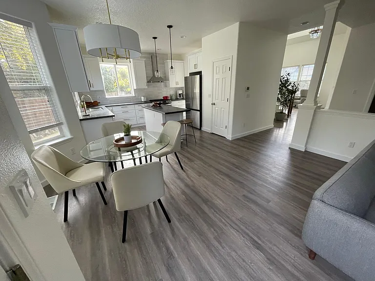 Open kitchen connected with breakfast nook and family room