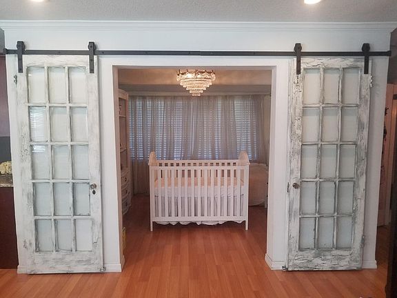 Bedroom with sliding barn doors. Also small walk in closet.
