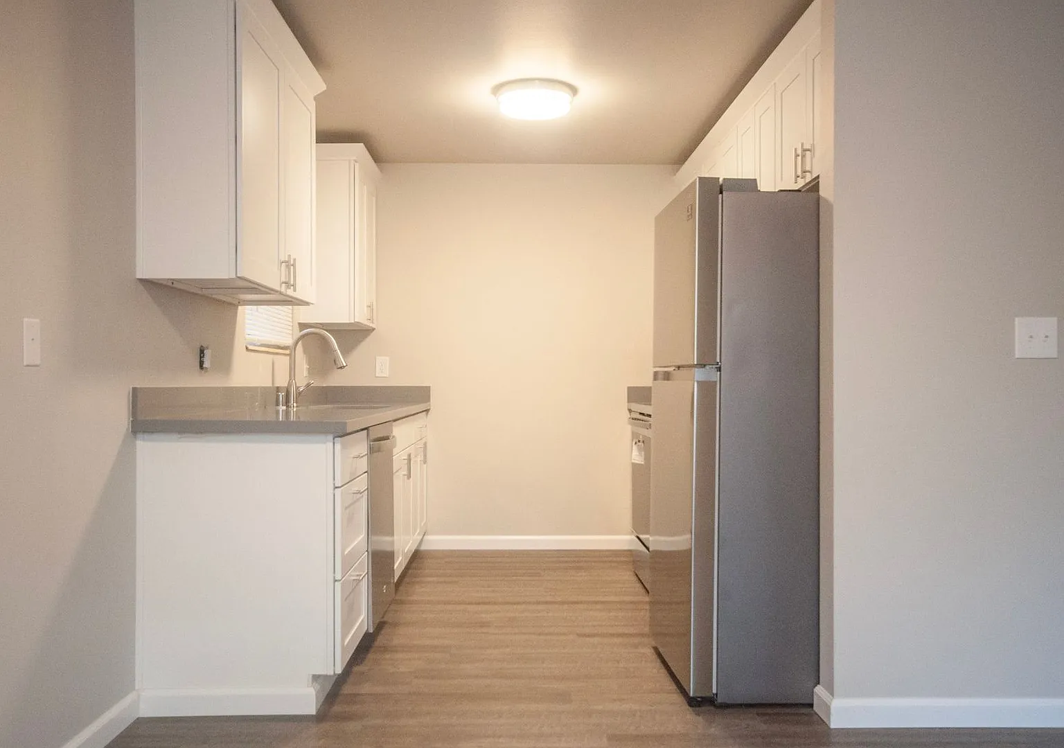 Quiet Apartment Living with In-Unit Laundry and Assigned Parking — Photo 3