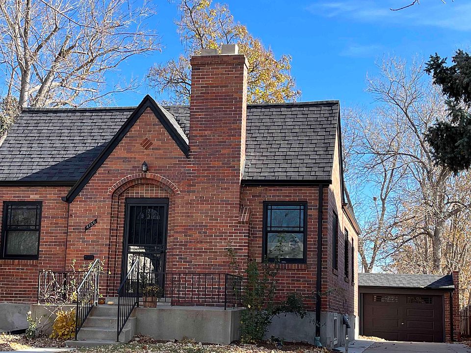 Tudor style home w street facing garage and driveway