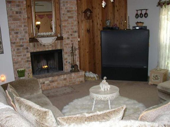 living room w/floor to ceiling fireplace