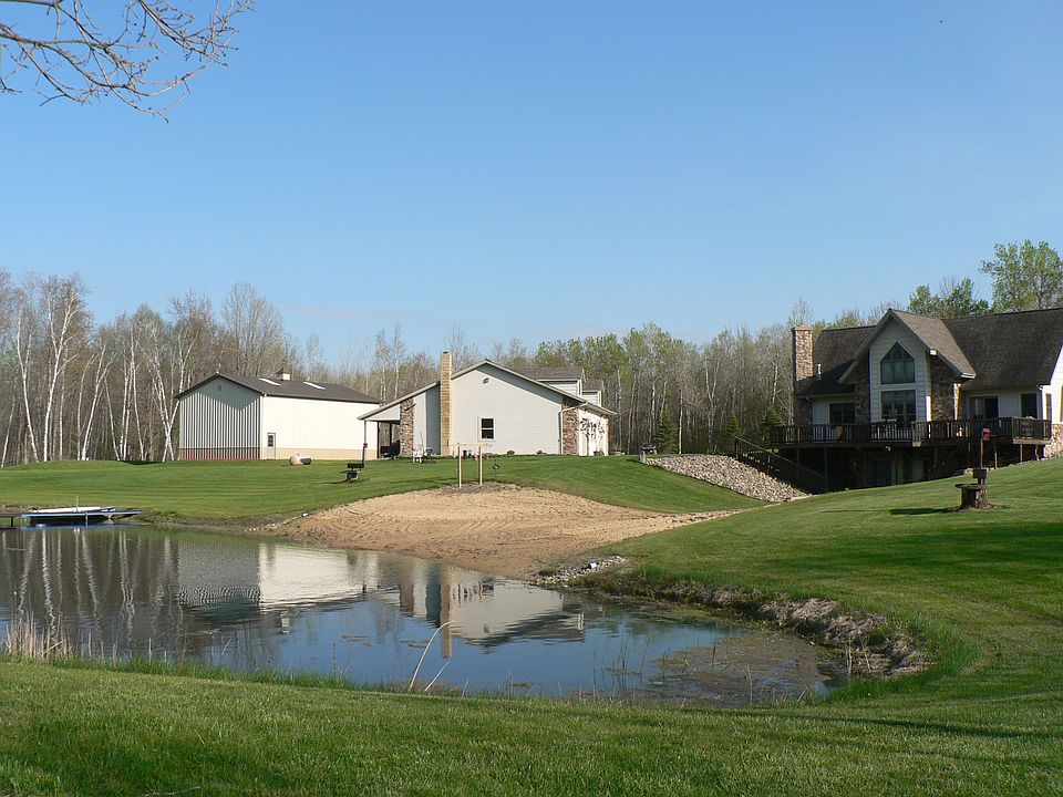 Home w/2 bldgs. and pond