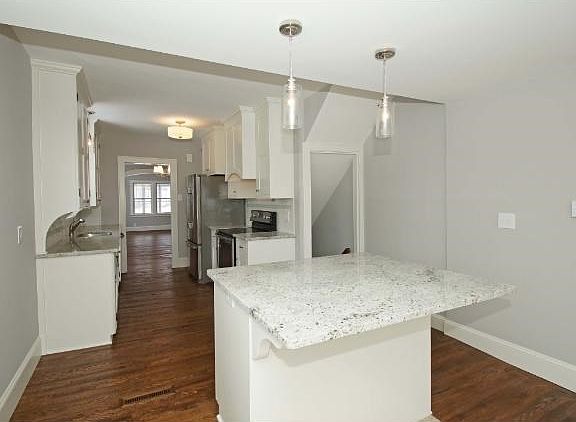 Center island is the perfect spot for a breakfast area with all new lighting, and a nice kitchen window.