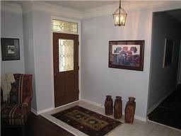 Tiled entryway. Extensive crown molding.