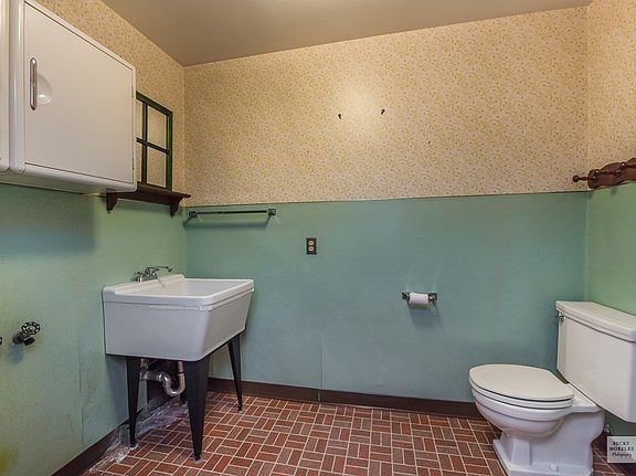 Current laundry room setup also has a 1/2 bath