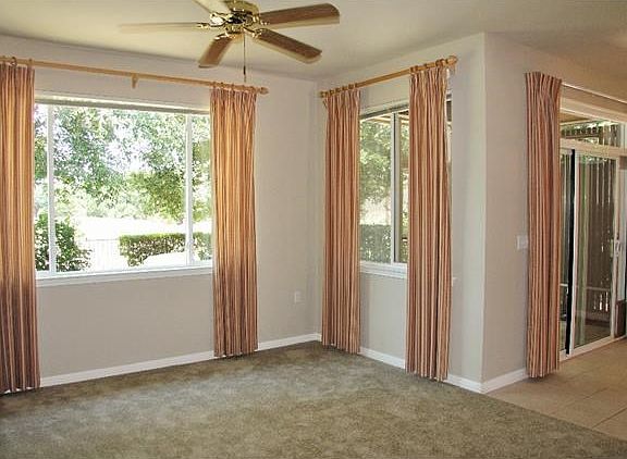 Open living area and kitchen with view of greenbelt