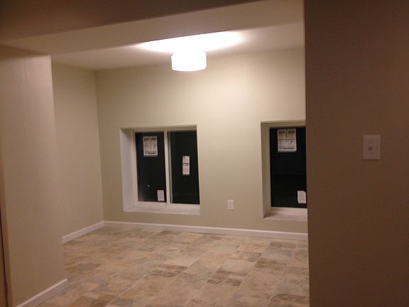 Newly renovated dining room with large windows.
