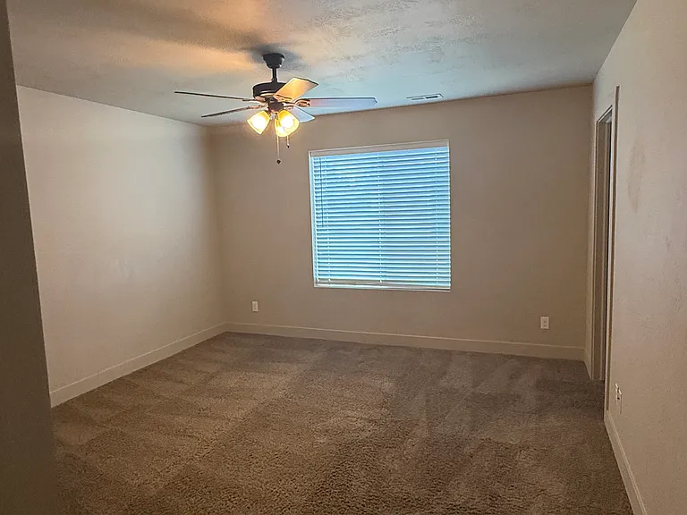 master bedroom showing door to bathroom