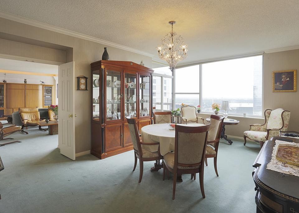 FORMAL DINING ROOM WITH VIEWS IN TO THE LIVING ROOM