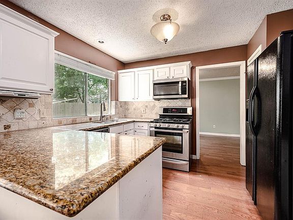This kitchen conveniently connects to the formal dining room, breakfast area and living room for easy entertaining!