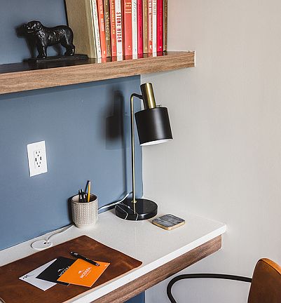 Built-in desk with USB ports and custom book shelves