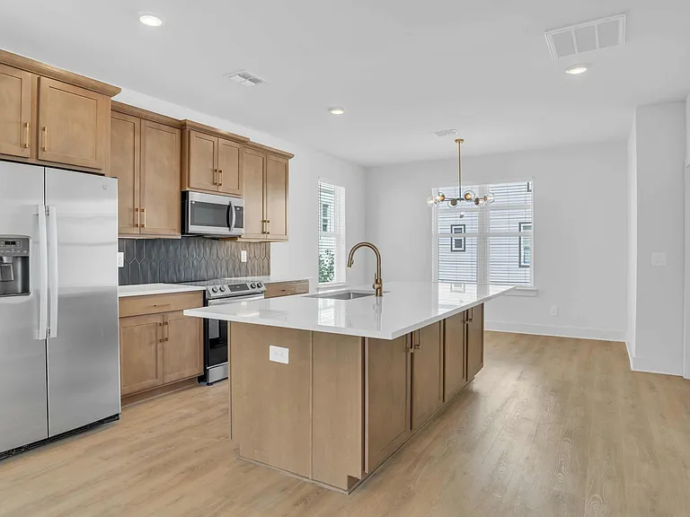 Spacious Kitchen with Modern Finishes and Island