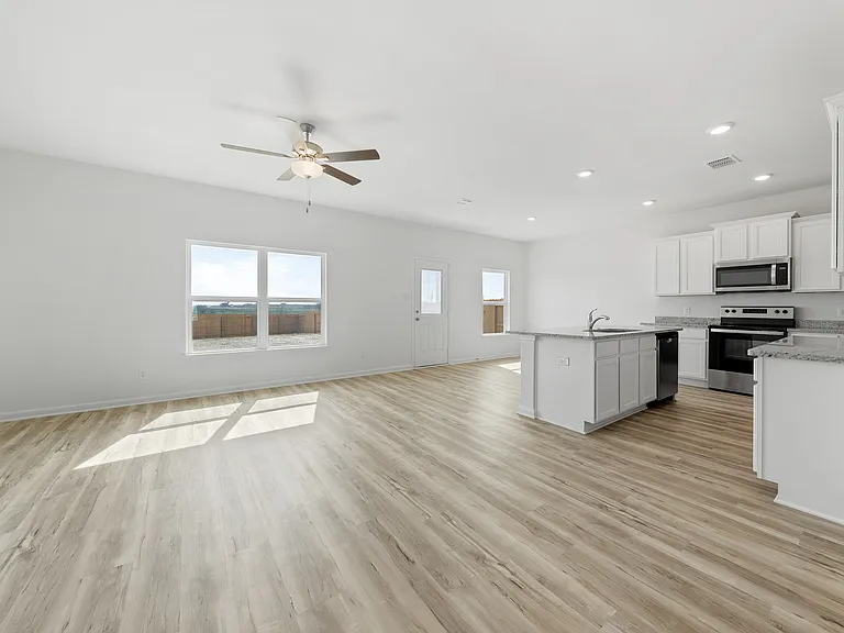 Vinyl flooring throughout the main living areas.