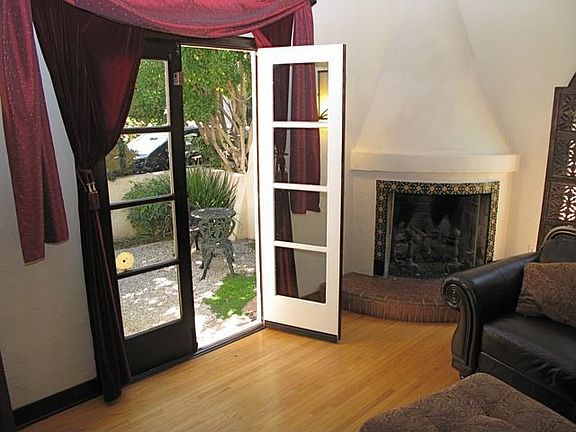 Corner hearth and French doors to side Courtyard