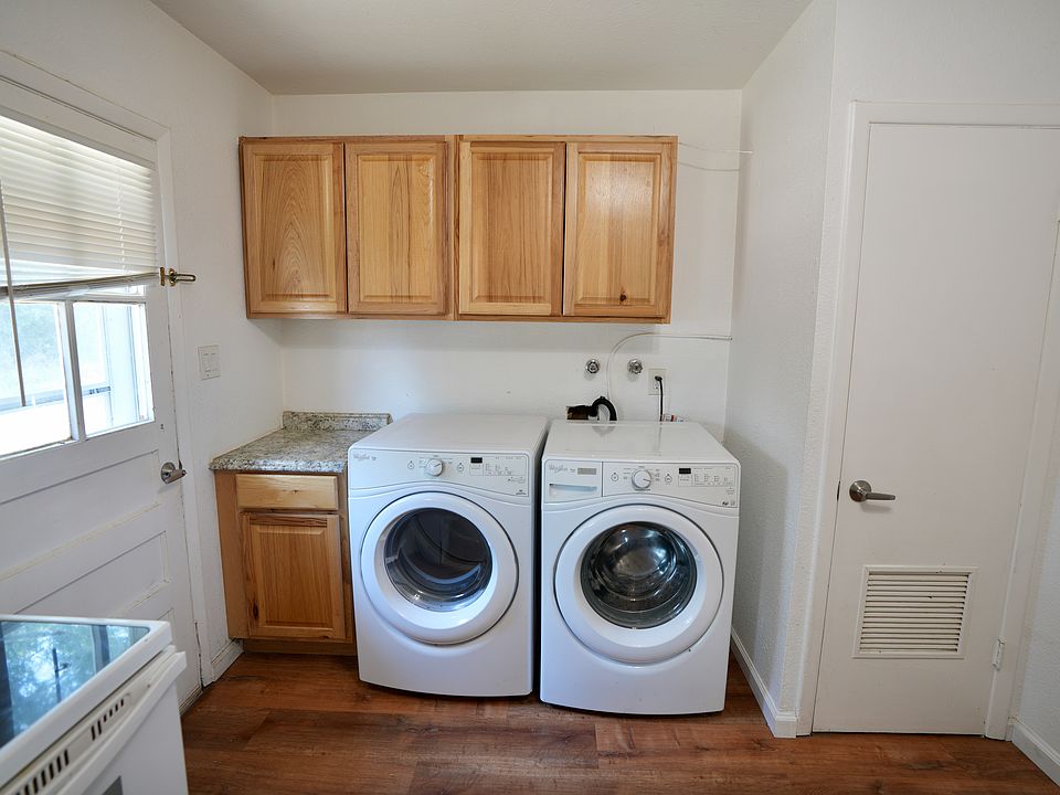 Front loaded washer and dryer. Planty of extra cabinets.