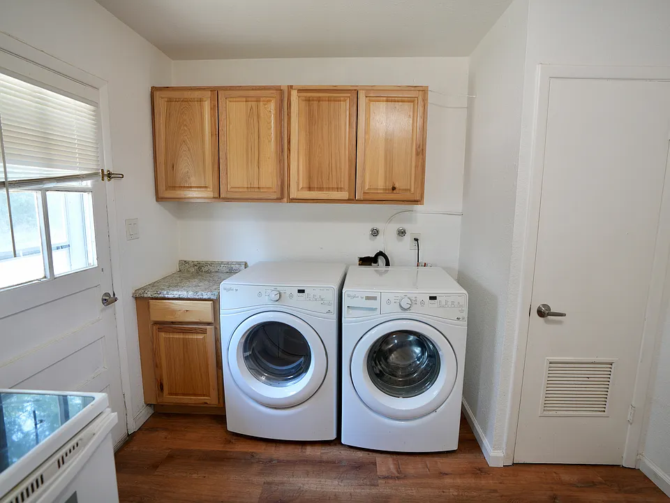 Front loaded washer and dryer. Planty of extra cabinets.