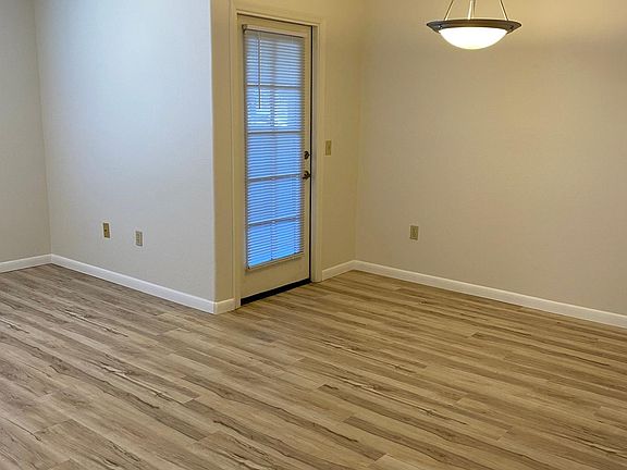 Living room with dining area. Door to balcony