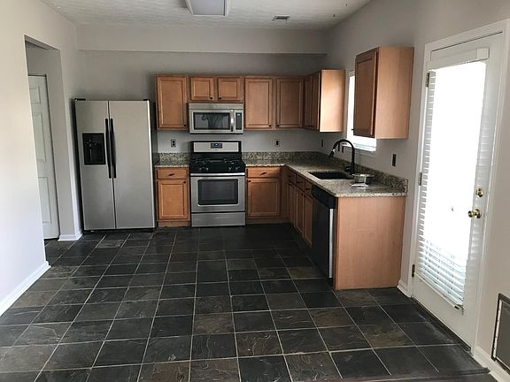 kitchen with tile floor and granite counter tops and SS appliances