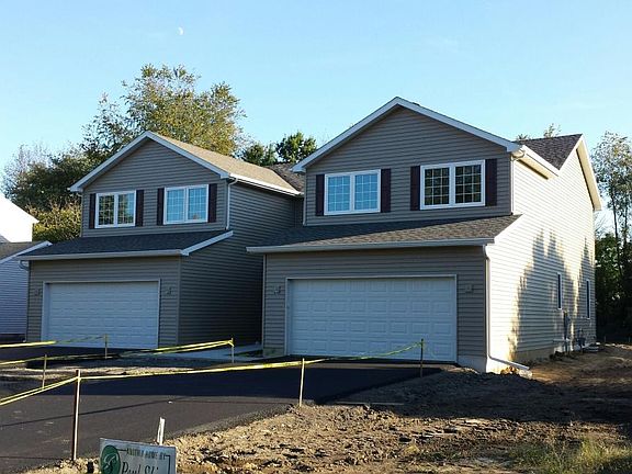 FRONT EXTERIOR (UNIT NOW HAS GRASS)