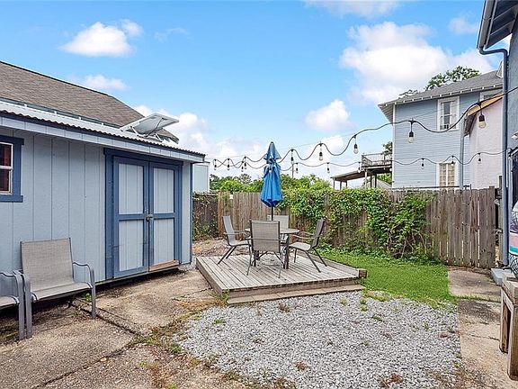 Private fenced back yard with storage shed.