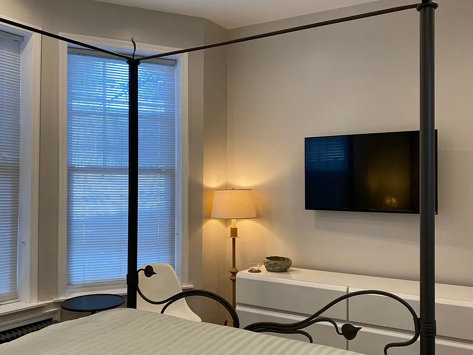 Wrought iron bed with new 50" smart TV