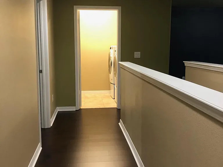 View from upstairs Foyer to Laundry room and 4th bedroom on the left