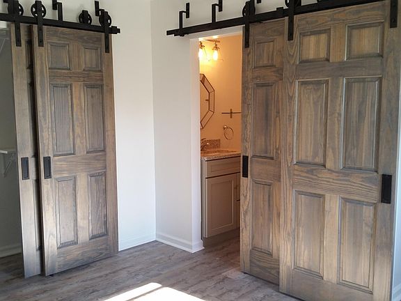 Beautiful solid barn doors and plenty of closet space.