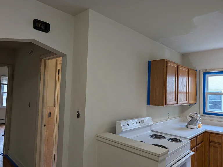 kitchen leading into hall into bathroom and bedroom