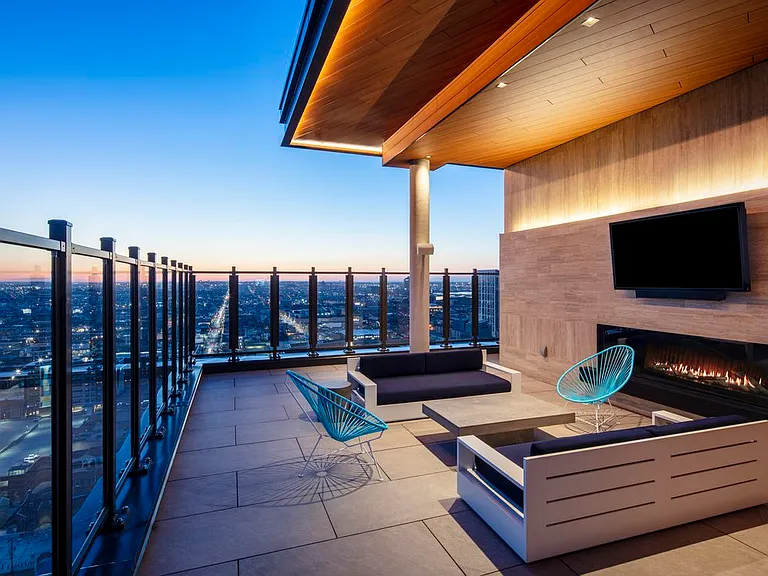 24th floor lounge area with fireplace and TVs