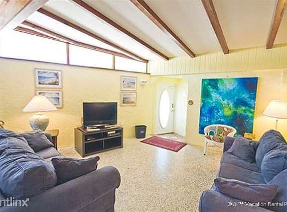 You'll love our living room's vaulted ceilings