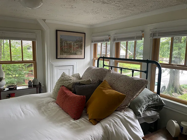 Bedroom, with windows all around.