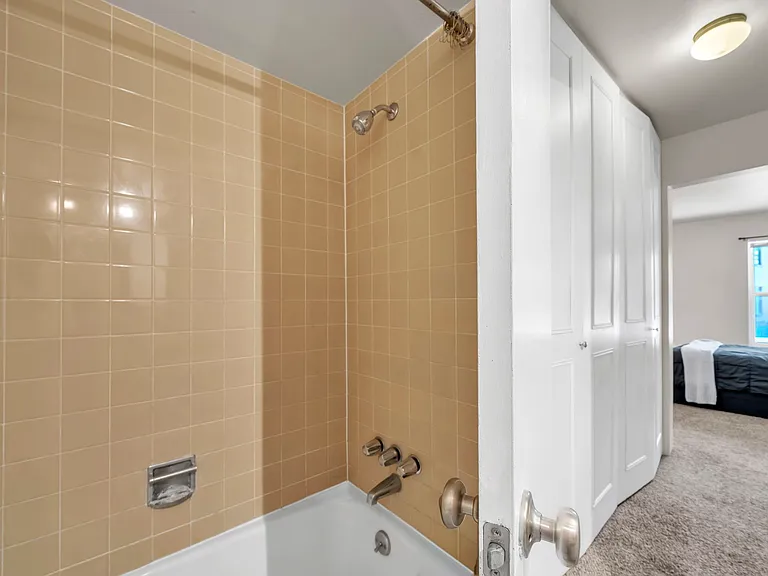primary bathroom and large bedroom window