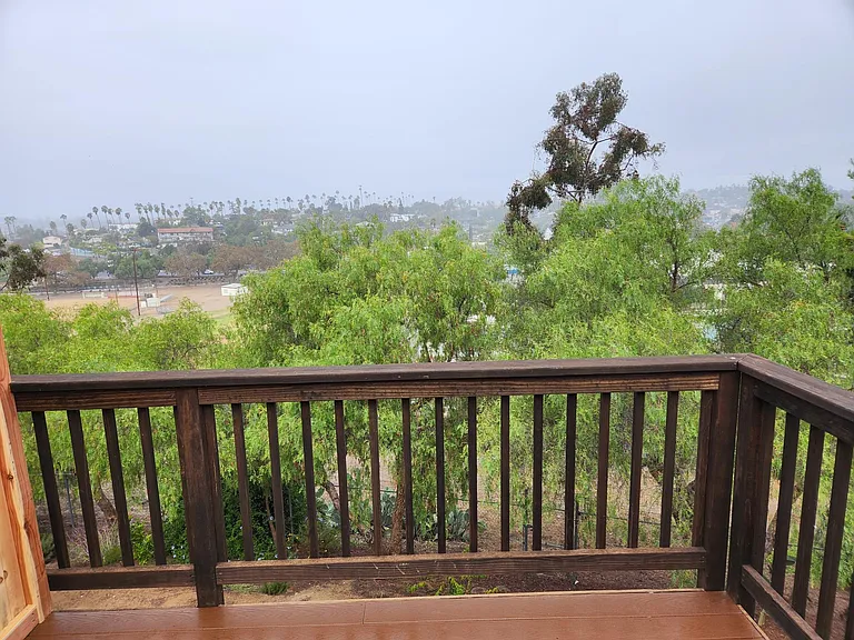 Another picture showing expansive view from deck. Unit is walkable to vibrant downtown eateries, coffee shops, bars and movie theater.