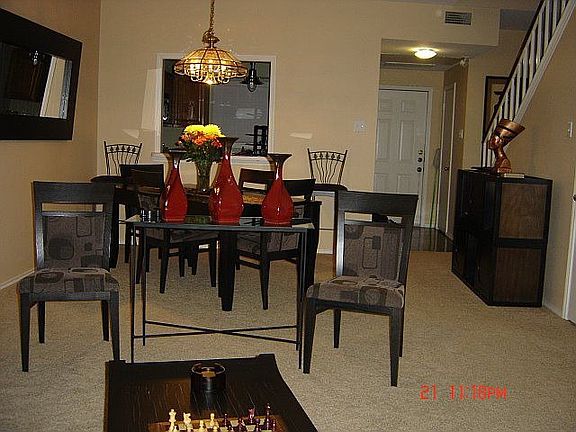 View of the foyer, dining room and partial view of kitchen.