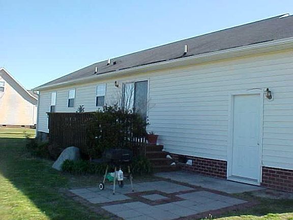 rear of home wtih wooden deck