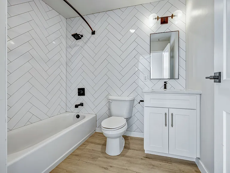 Step into luxury at Luckey Platt with this beautifully designed bathroom featuring modern fixtures and stylish herringbone tiles. Enjoy a serene retreat in your home. Schedule your visit today to see it all for yourself!