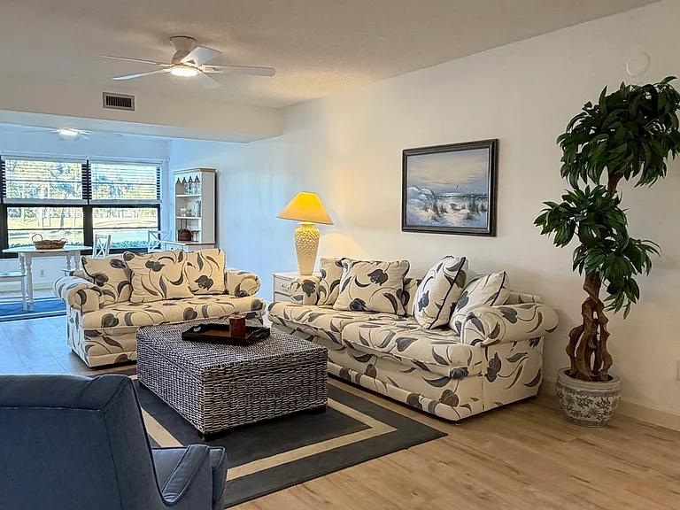 Beautiful living area w/ newly installed plank floors throughout