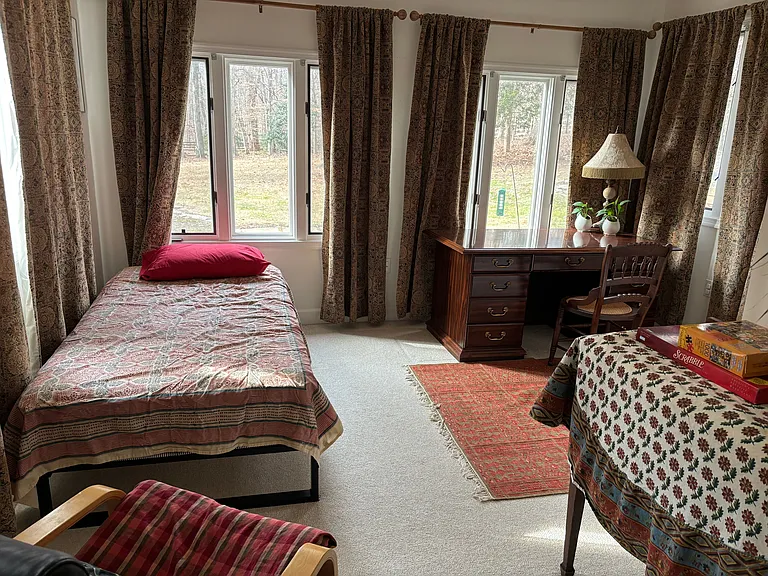 2nd bedroom with a view of the outdoors.