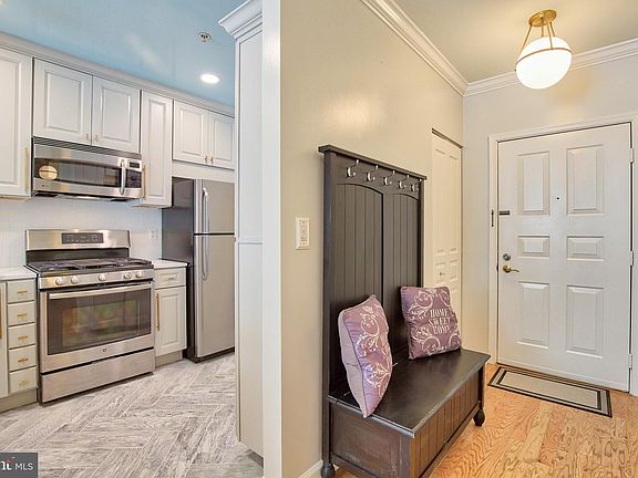 Hall entry setee conveys with the rental. Dimmers throughout the apartment.