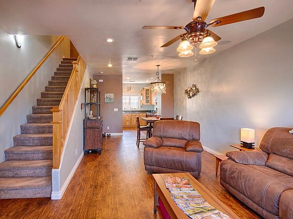 Living room, dining room and kitchen with stairs