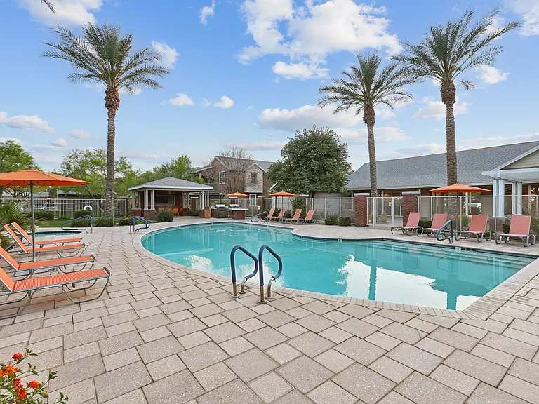 Welcome to Highland Groves at Morrison Ranch, where luxury living meets resort-style amenities. Take a dip in our sparkling pool surrounded by palm trees, perfect for relaxation. Schedule your tour today and elevate your lifestyle!