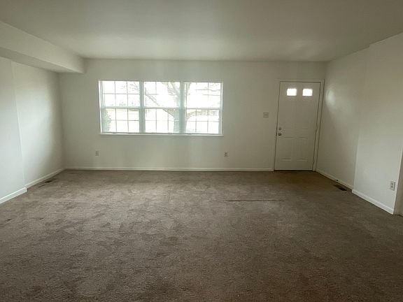 Large Living Room with a triple window