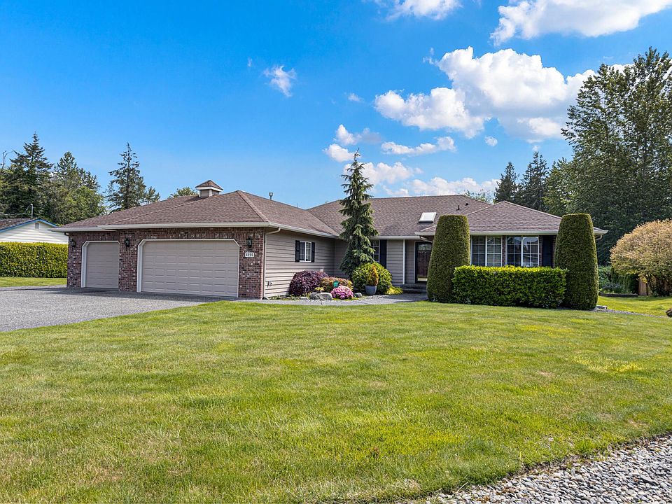 Three car garage, ample RV parking and storage shed