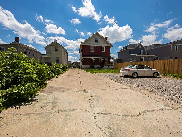 Exterior with offstreet parking in back yard
