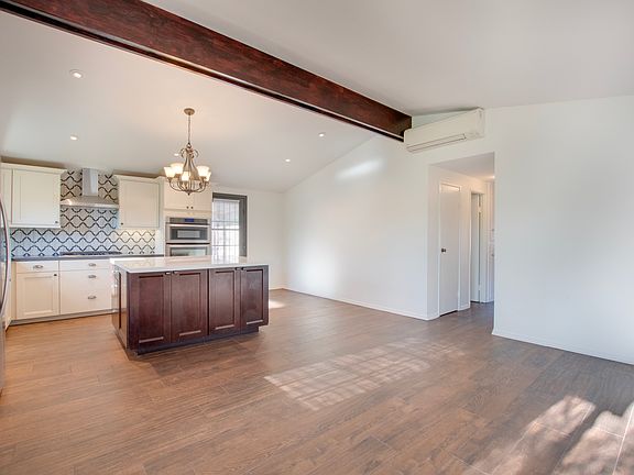 Entry, open living room, kitchen and dining room