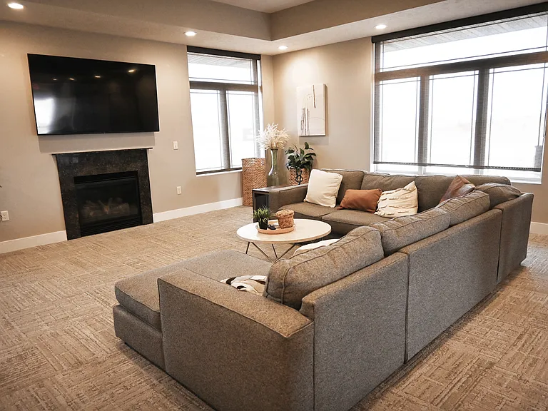 Community fireplace and lounge area at The Sterling Grand Island.