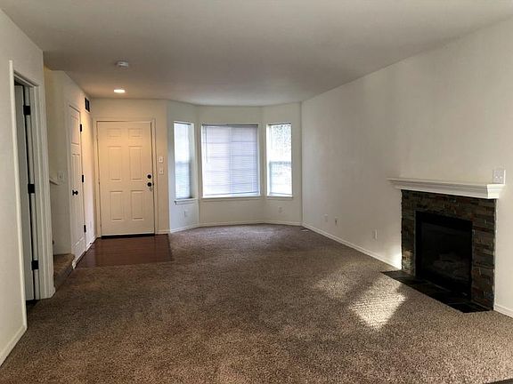 Cozy living space with fireplace.