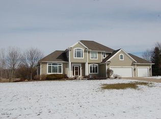 2302 Grand Valley Dr NE, Ada, MI 49301