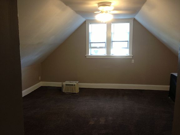 Third floor bedroom includes a window A/C unit