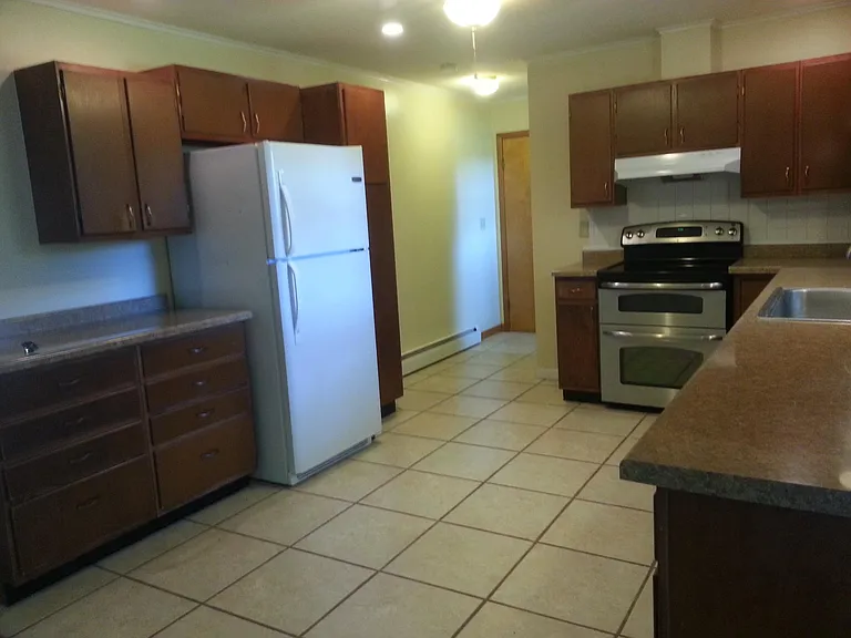 Large kitchen with abundant cabinet space.
